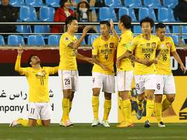 Guangzhou Evergrande players celebrate after scoring a goal in an AFC Champions League match. AFP