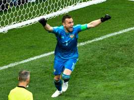 Akinfeev's heriocs put hosts Russia through to the next round at the expense of Spain. AFP
