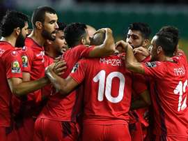 Les joueurs tunisiens se congratulent après un but contre le Zimbabwe lors de la CAN. AFP