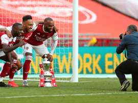 Lacazette (R) wants to stay at Arsenal. AFP
