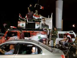Les supporters syriens fêtant le match nul de leur équipe contre l'Iran à Téhéran. AFP