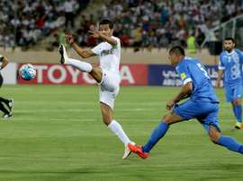 L'Iranien Masoud Shojaei lors dun match face à l'Ouzbékistan en qualifications au Mondial 2018. AFP