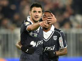 Malcom et Gaëtan Laborde se félicitent (g), face Nice en CDL. AFP