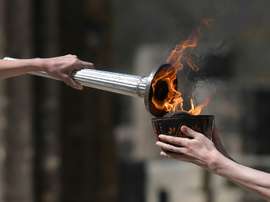 Le relais de la flamme olympique réaménagé, un haut dirigeant contaminé. AFP