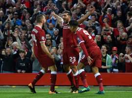 Emre Can scored twice, as Liverpool secured their place in this year's Champions League. AFP