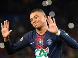 Mbappe says he is not as good as Messi and Ronaldo. AFP