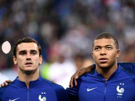 If Griezmann signs for PSG, Mbappe may have to leave the club. AFP