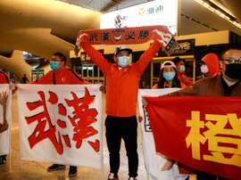 Les joueurs de l'équipe de foot de Wuhan de retour chez eux après 3 mois d'absence. AFP