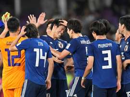 Les Japonais célèbrent leur victoire sur les Iraniens. AFP