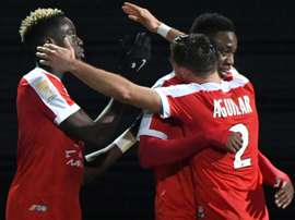 Isaac Mbenza, félicité par ses coéquipiers après son but contre Angers. AFP