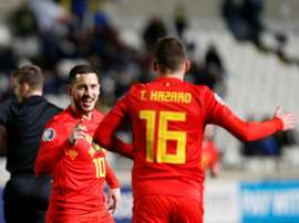 Eden Hazard félicité par son frère Thorgan après son but contre Chypre. AFP