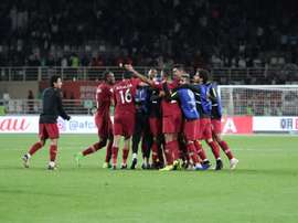Les joueurs du Qatar fêtent leur qualification pour les quarts de finale. AFP
