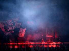 Des supporters de l'AC Milan au San Siro lors du match de Serie A face à Cagliari. AFP