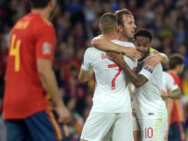 Kane celebrates with Ross Barkley and Raheem Sterling. AFP