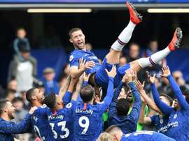 Gary Cahill is held aloft by the Chelsea squad as the defender leaves Chelsea. AFP