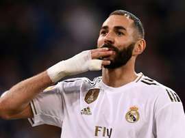 Juninho rêve de voir revenir Benzema. AFP