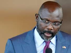 Weah honore Le Roy et Wenger. AFP