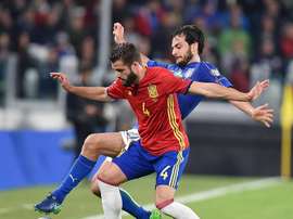 Spain's Nacho battling for the ball. EFE