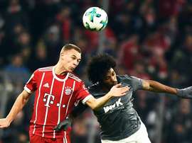 Bayern Munich's Joshua Kimmich (L) in action against Augsburg's Caiuby (R) during the German Bundesliga soccer match between Bayern Munich and FC Augsburg in Munich, Germany. EFE/EPA