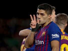 Suarez celebrates his contribution to Barcelona's convincing win over Sevilla. EFE