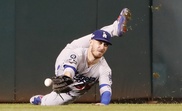 Los Angeles Dodgers center fielder Cody Bellinger misplays what was ruled a double, after the ball stuck under the wall, off the bat of Washington Nationals batter Trea Turner in the bottom of the sixth inning of their MLB National League Divsion Series playoff baseball game four at Nationals Park in Washington, DC, USA. EFE/EPA/ERIK S. LESSER