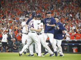 Houston Astros pitcher Gerrit Cole (3R) embraces relief pitcher Roberto Osuna (4R) as the Houston Astros defeat the Tampa Bay Rays in the MLB American League Divsion Series playoff baseball game five at Minute Maid Park in Houston, Texas, USA, 10 October 2019. EFE/EPA/LARRY W. SMITH