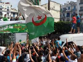 Algerian national team players are greeted by fans upon their return from the 2014 FIFA World Cup on July 2, 2014, in the capital Algiers.