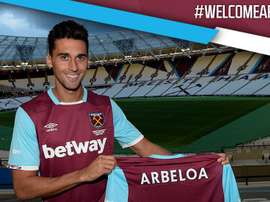 Arbeloa poses for photos at his new club's stadium. WestHam