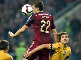 Artem Dzyuba, centre, seen in action with Russia national team against Moldova in October 2014, will play club football for Zenit this year