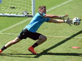 Australia goalkeeper Matthew Ryan makes a save during a training session in Vitoria, Brazil, on June 9, 2014