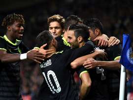 Chelsea celebrate on of Cesc Fabregas' extra-time goals. ChelseaFC