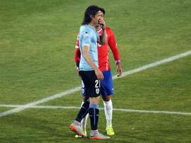 Chile football team defender Gonzalo Jara (back) provokes Uruguay Edinson Cavani (front) during their Copa America 2015 quarterfinals football match in Santiago