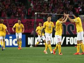 China Guangzhou Evergrande players celebrate after scoring a goal during an AFC Champions League match in Osaka, in May 2014