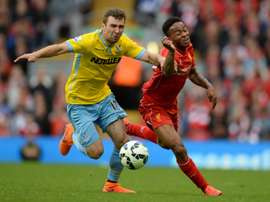Crystal Palace Scottish midfielder James McArthur (L) during the English Premier League football match against Liverpool on May 16, 2015