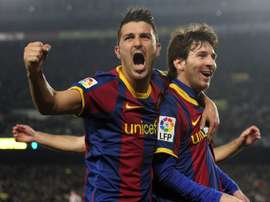 Villa pictured with Messi. AFP