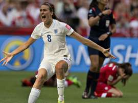 England midfielder Jill Scott celebrates as Canada defender Allysha Chapman (R) reacts to their loss during a quarterfinal football match at the 2015 Women World Cup in Vancouver on June 27, 2015