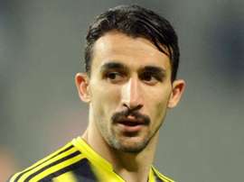 Fenerbahce's Mehmet Topal luckily escapes unharmed