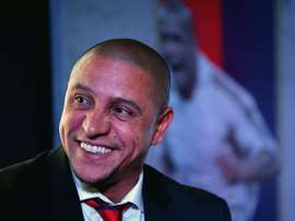 Formar Brazilian football player and team manager of Delhi Dynamos Roberto Carlos talks during a press confrence in the Indian capital New Delhi on July 9, 2015