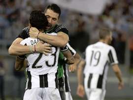 Buffon and Alves celebrating a win in their Juventus days. EFE