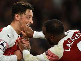 Ozil sourit. Goal