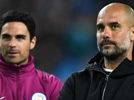 Guardiola with assistant Mikel Arteta. GOAL