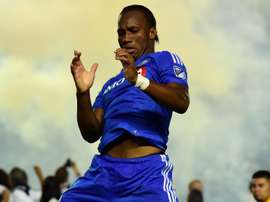 Didier Drogba celebrating a goal. Goal