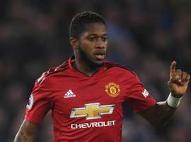 Fred hit by object during Manchester derby and seemingly subjected to racist abuse. GOAL