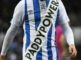 Huddersfield Town charged with misconduct following fake kit stunt. GOAL