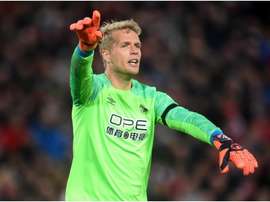 Jonas Lossl is heading to Everton. GOAL
