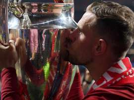 Henderson lead his team to a Champions League victory. GOAL