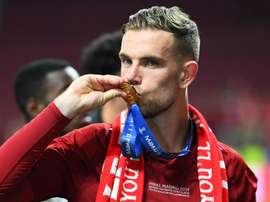 Captain Jordan Henderson had an emotional moment with his father on the pitch. GOAL