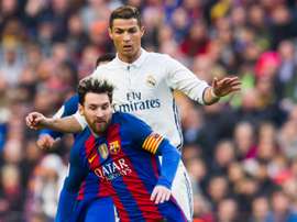 Lionel Messi du Barcelona et Cristiano Ronaldo, du Real Madrid dans un match de La Liga. AFP