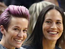 USA World Cup winner Megan Rapinoe (L) has got engaged. GOAL