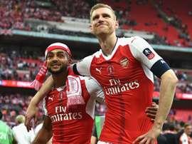 Mertesacker, happy after winning the FA Cup final. AFP